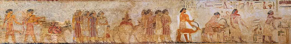 Egyptian tomb painting of a procession of Levantine men, women and children in patterned clothes, with donkeys, arriving in Egypt