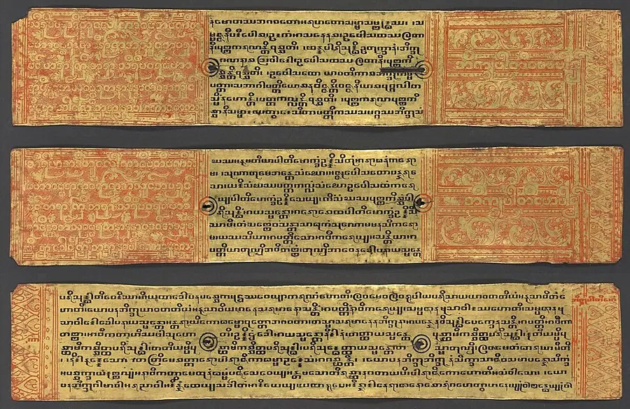 Three lacquered manuscript folios in gold and red, with Burmese-script Pali text of the nuns' monastic rules framed by decorative panels