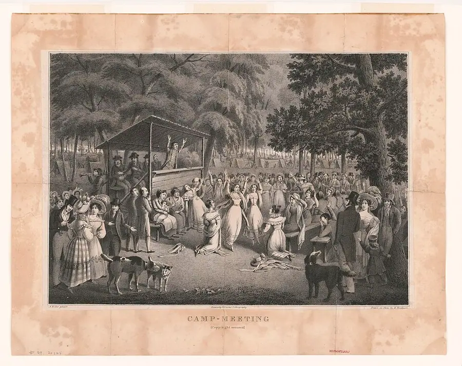 Lithograph of an American camp meeting, 1829: a preacher in a wooden stand, people kneeling and raising their arms, tents among trees