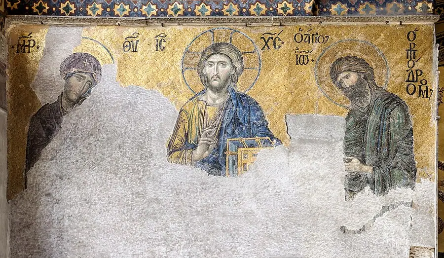The Deësis mosaic in the south gallery of Hagia Sophia, Constantinople: Christ in the centre, with the Virgin Mary and John the Baptist on either side, much of the lower half lost