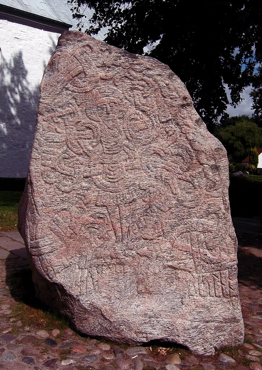 Harald Bluetooth's large runestone at Jelling, Denmark, a granite boulder carved with interlace