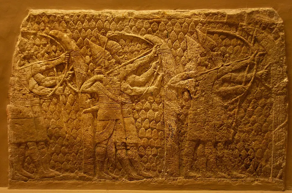 Assyrian archers in pointed helmets drawing their bows, from the Lachish reliefs