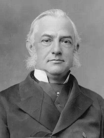 Black-and-white photograph of Friedrich Max Muller, white-haired, in a dark coat