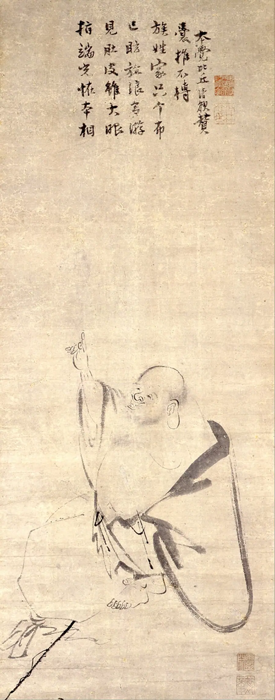 Ink painting of a bald, bearded monk in loose robes pointing upward, with a sack, under a column of calligraphy