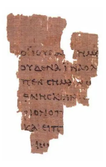 The John Rylands papyrus P52, a small brown fragment with seven partial lines of Greek from John 18