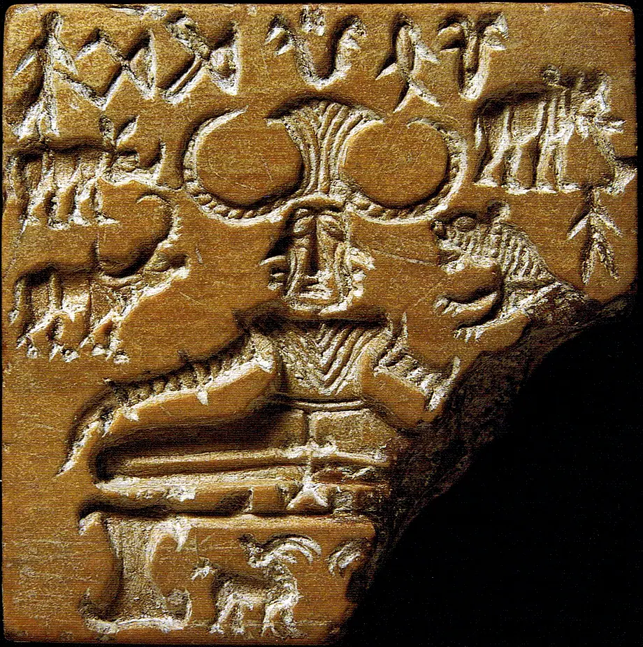 Close-up of the Pashupati seal: a horned figure seated cross-legged, with animals around it