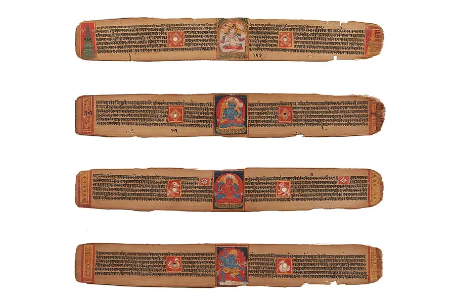 Four long palm-leaf folios of Sanskrit text, each with a small painted panel of a deity in the centre