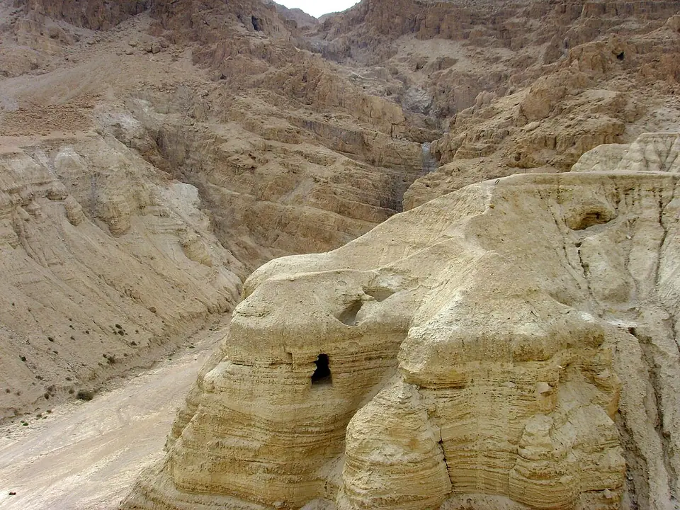 The openings of a cave in the eroded cliffs at Qumran above the Dead Sea, where scrolls were found