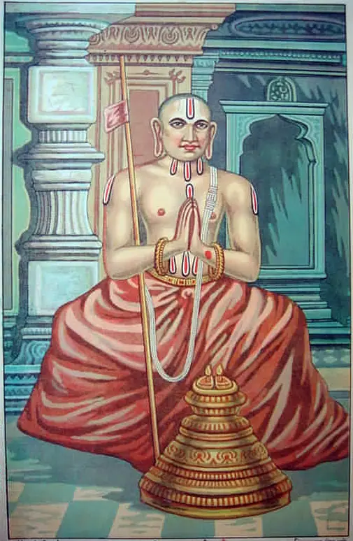 Devotional painting of Ramanuja seated with palms joined, in red robes, holding a staff