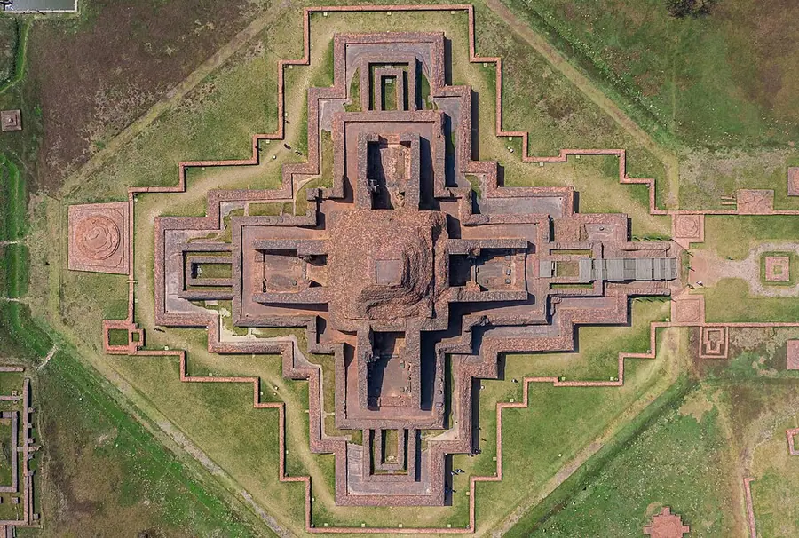 Aerial view of the cross-shaped terraced brick temple at the centre of Somapura Mahāvihāra, inside a square enclosure of monks' cells