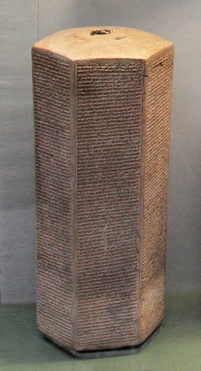 A six-sided clay prism covered in cuneiform, the Taylor Prism of Sennacherib, in a museum case