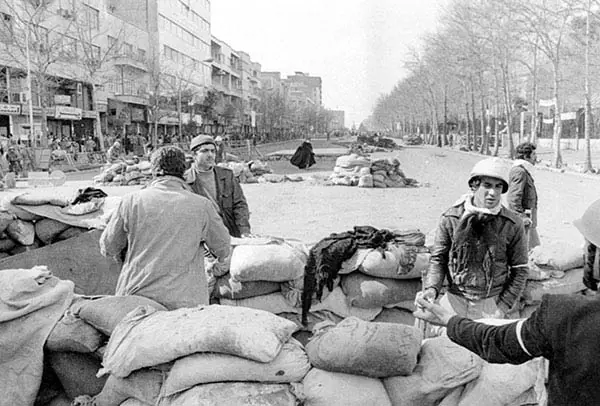Revolutionaries behind sandbags on Shahreza Avenue in Tehran during the revolution of 1979