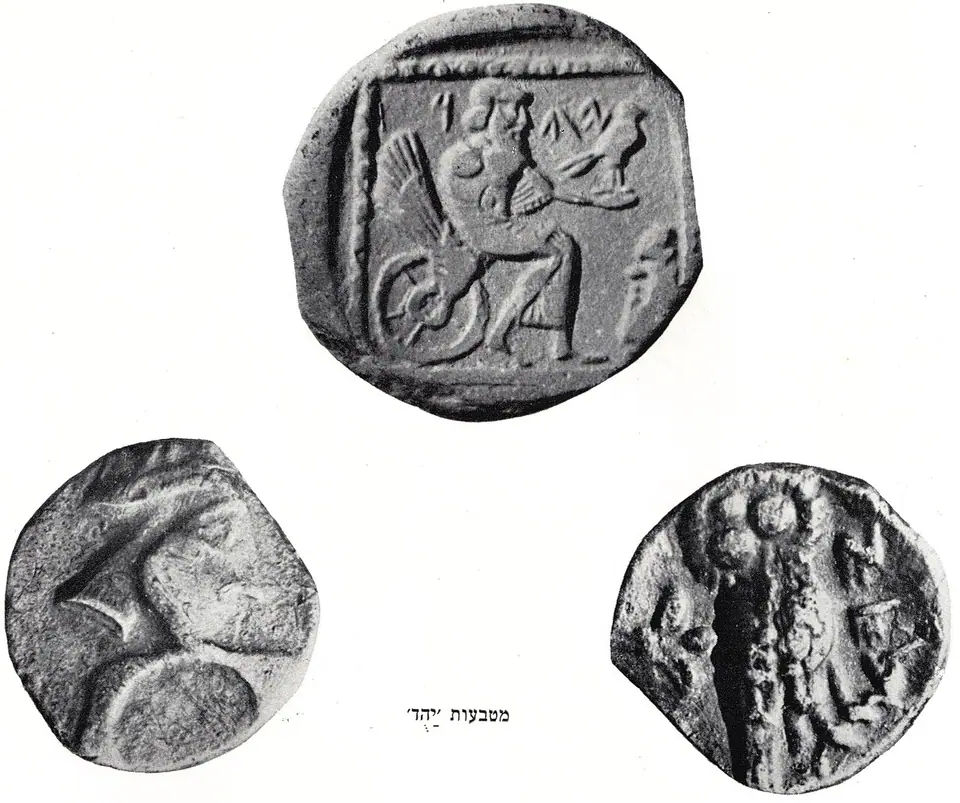 Photographs of small silver coins of the Persian province of Yehud, inscribed with the letters YHD